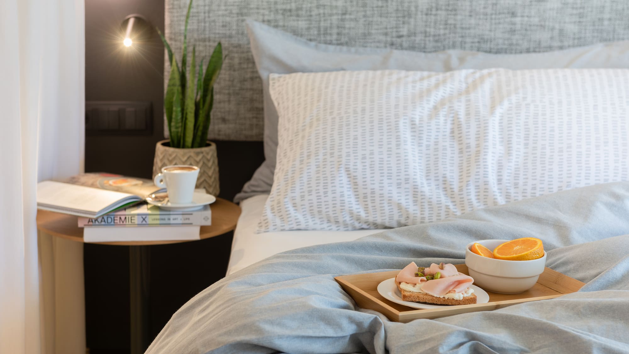 a tray of food on a bed