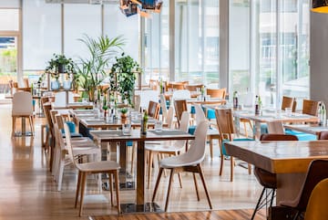 a restaurant with tables and chairs