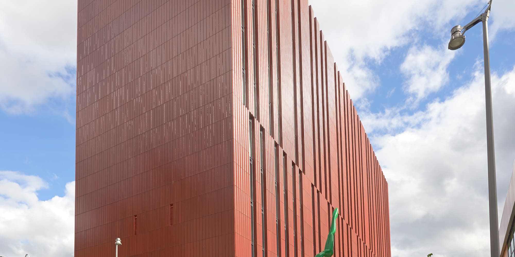 a building with glass walls and a metal structure