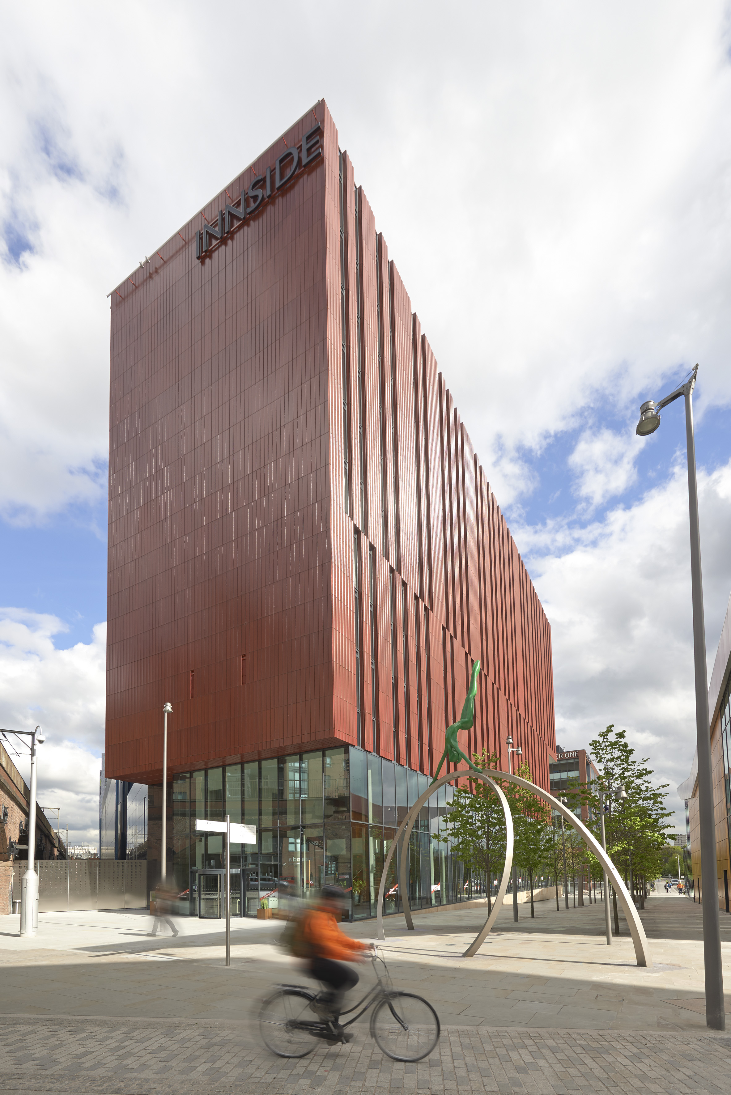 a building with glass walls and a metal structure