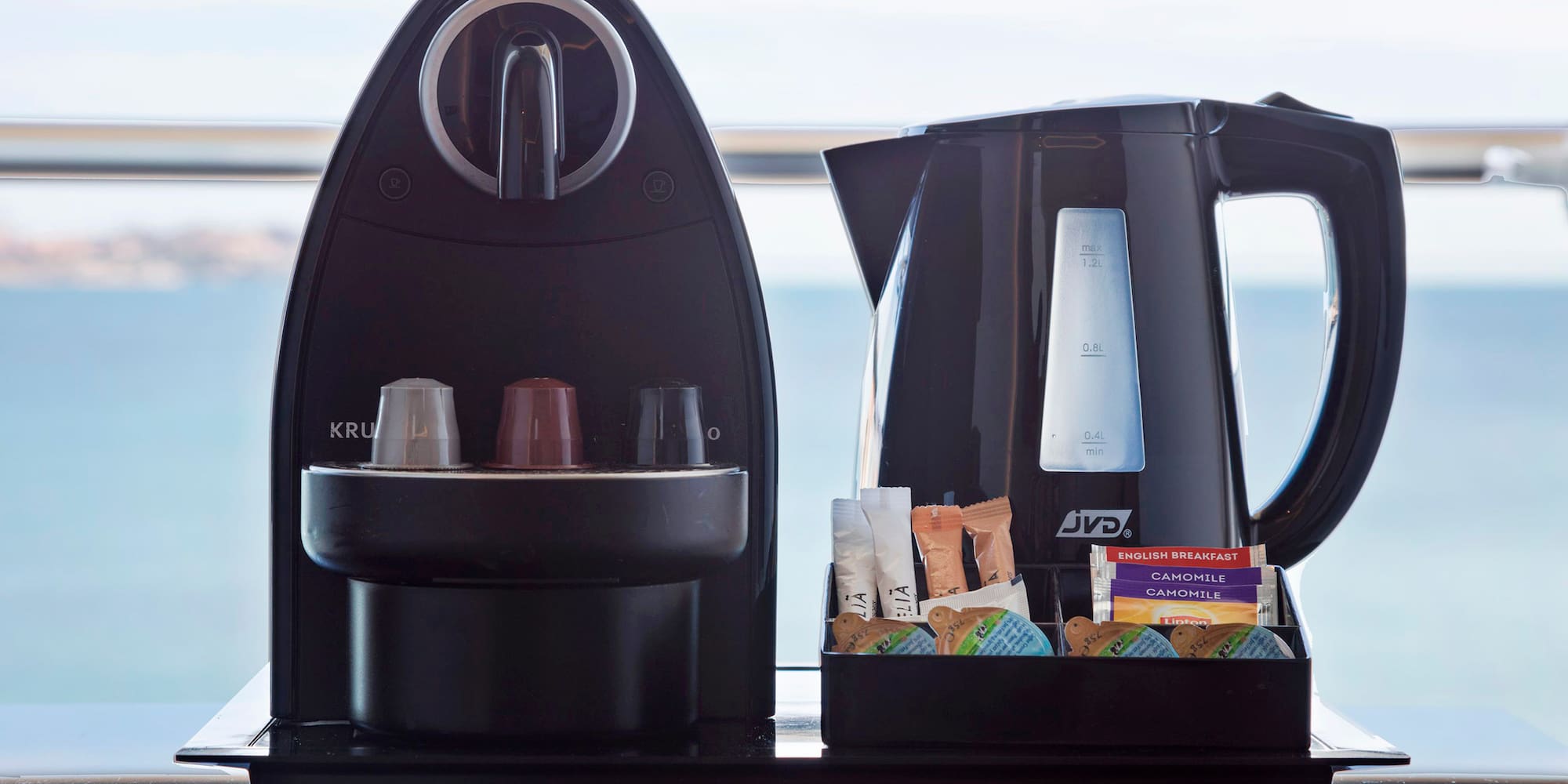 a coffee maker and a container of food