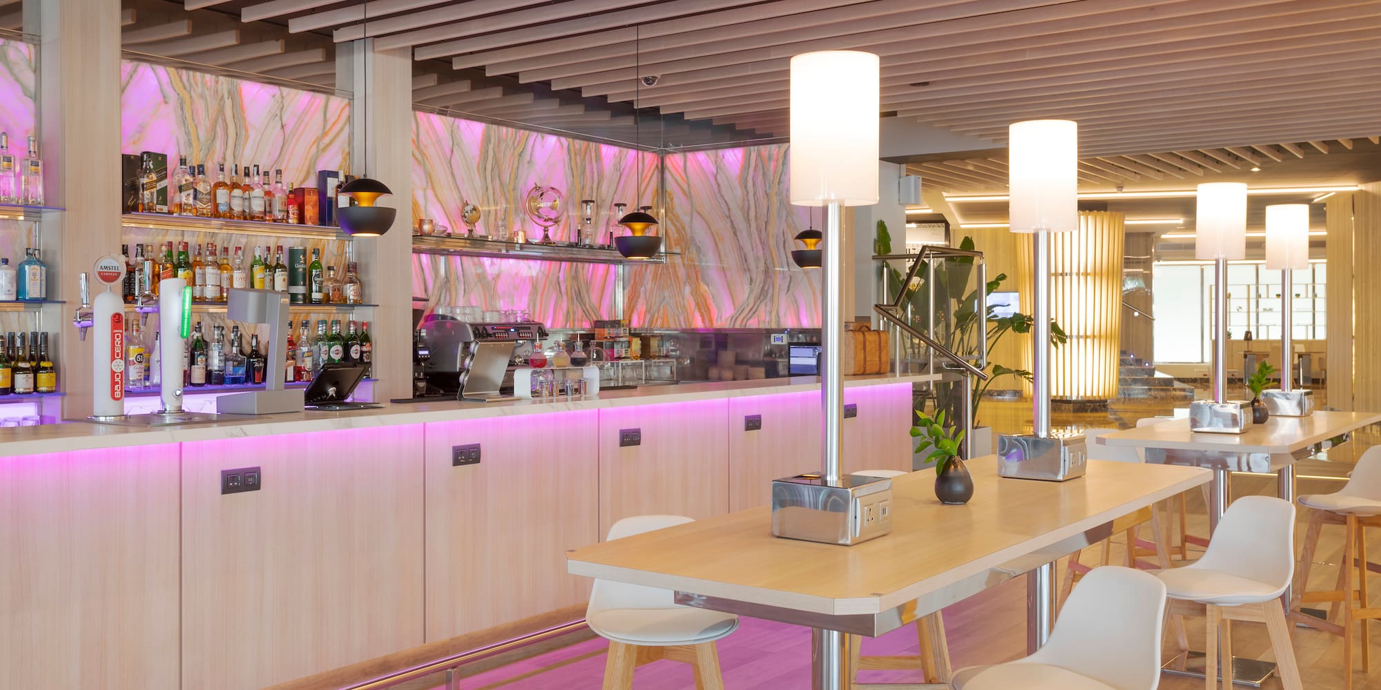 a bar with a counter and chairs