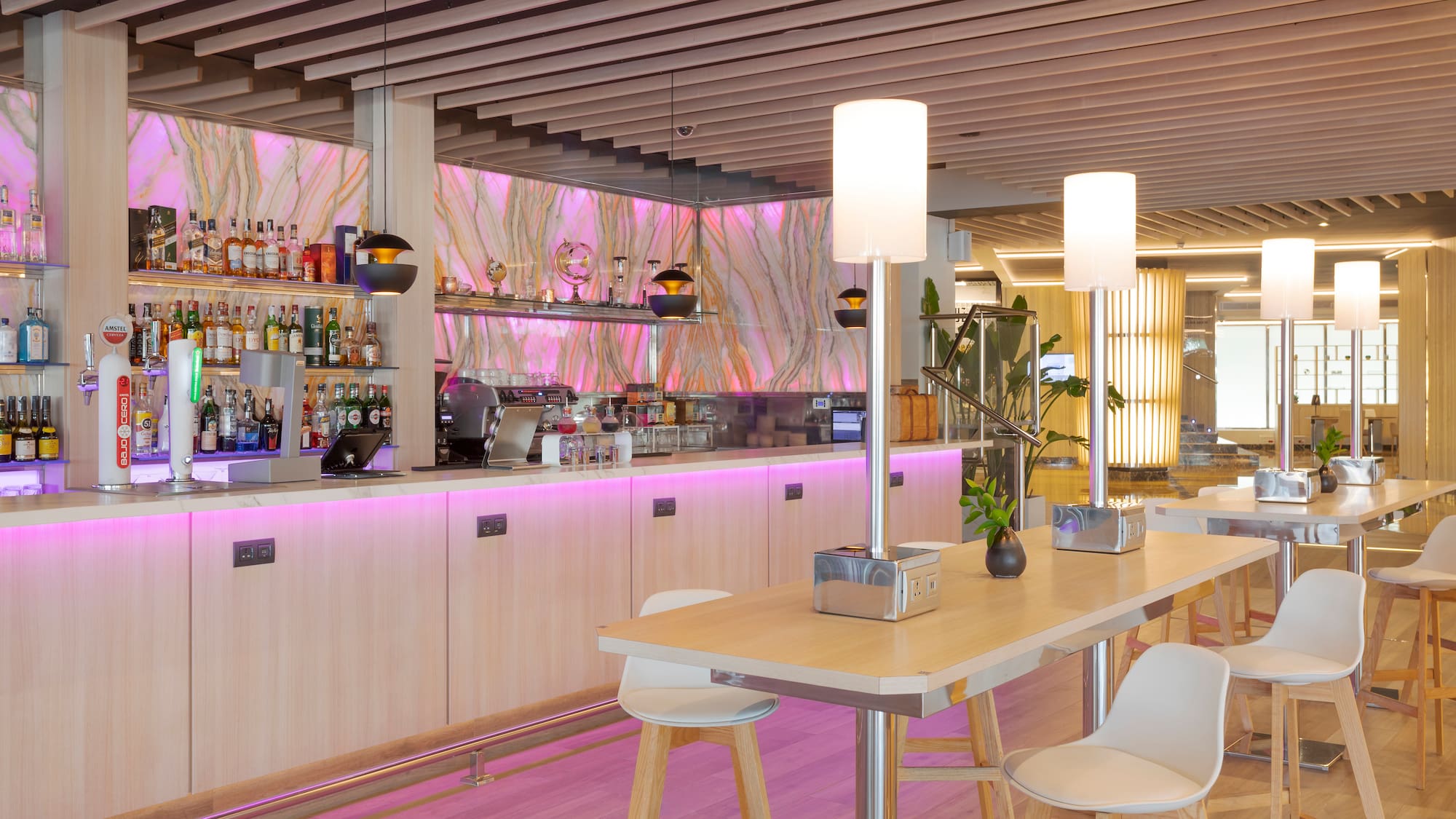 a bar with a counter and chairs