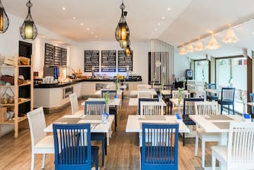 a restaurant with tables and chairs