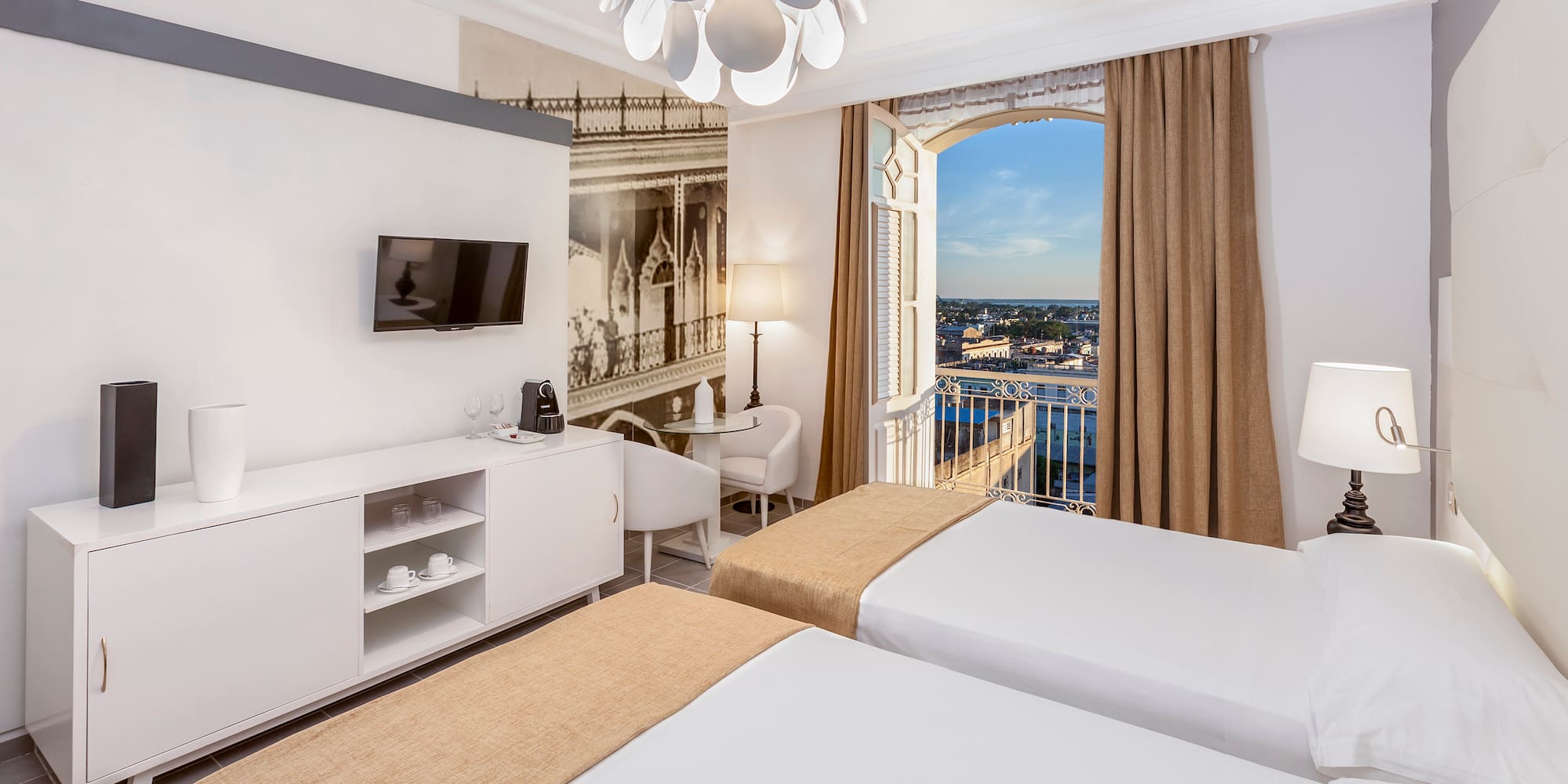 a room with two beds and a window