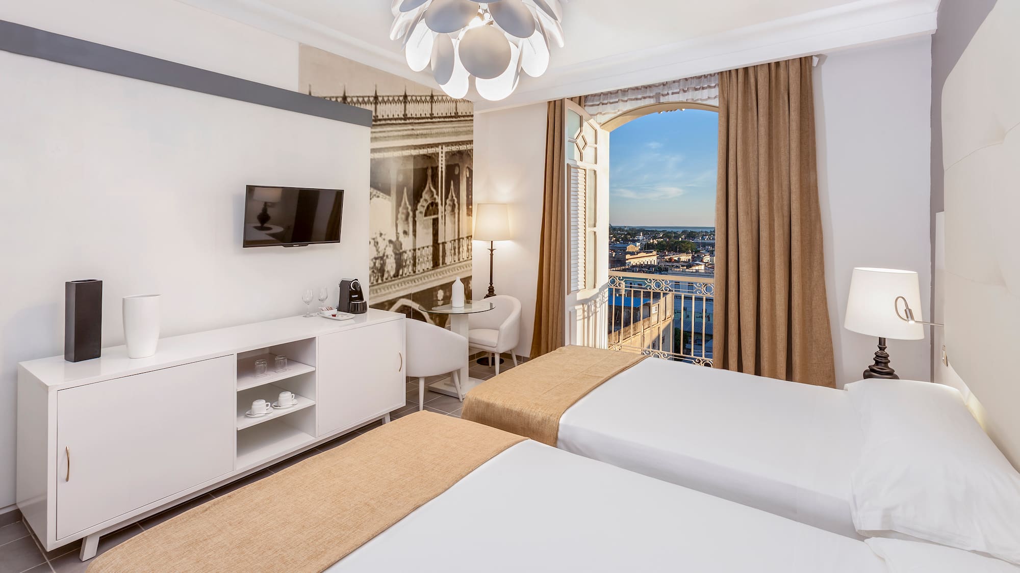 a room with two beds and a window