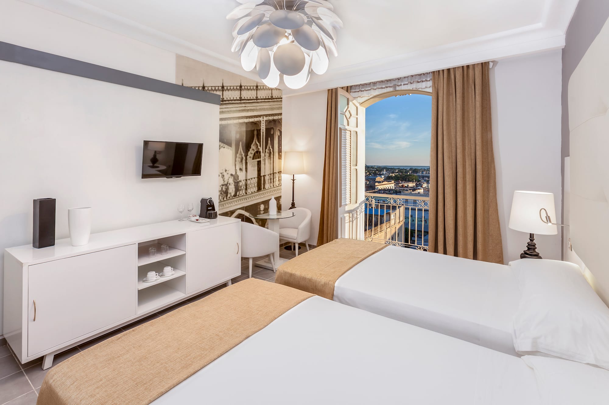 a room with two beds and a window