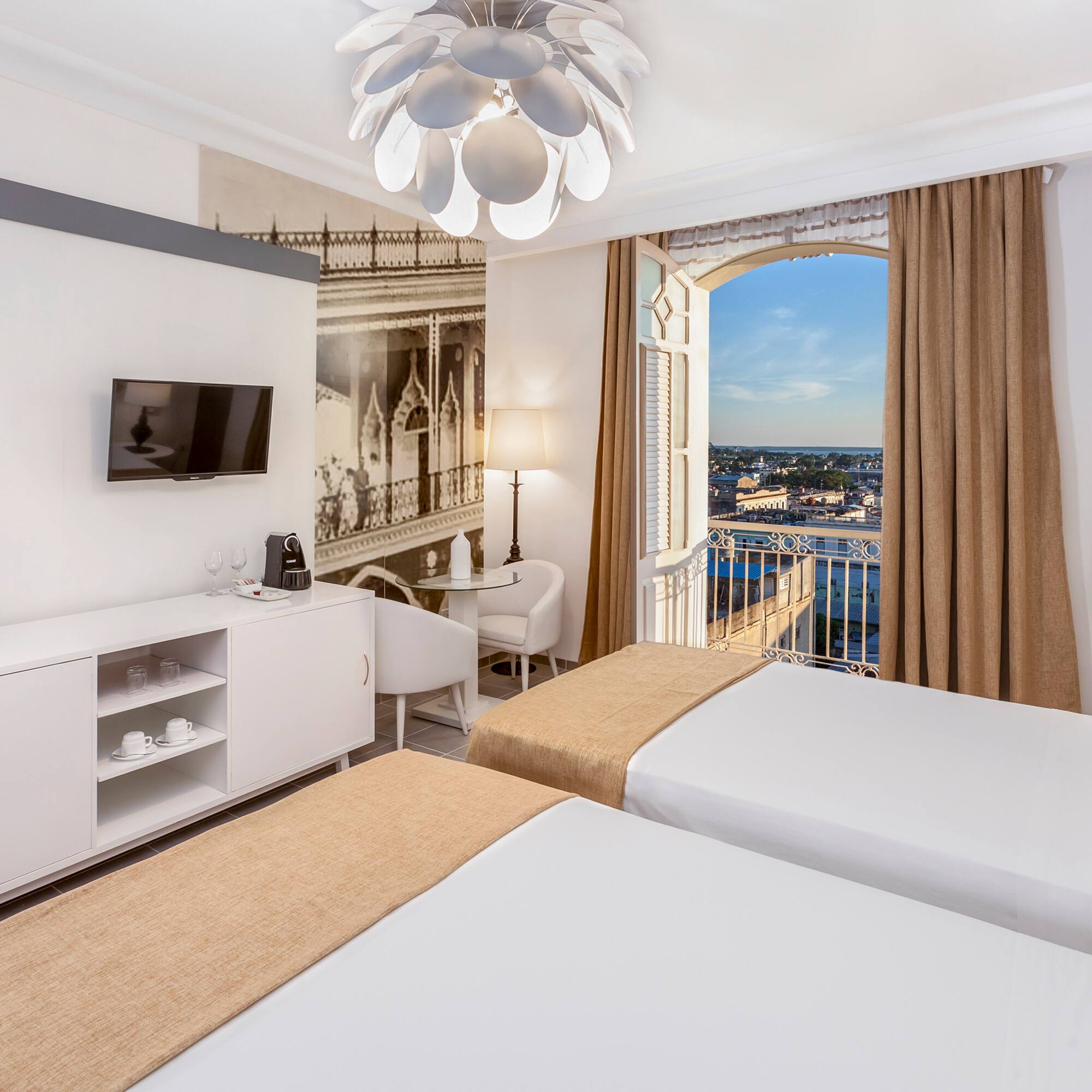 a room with two beds and a window