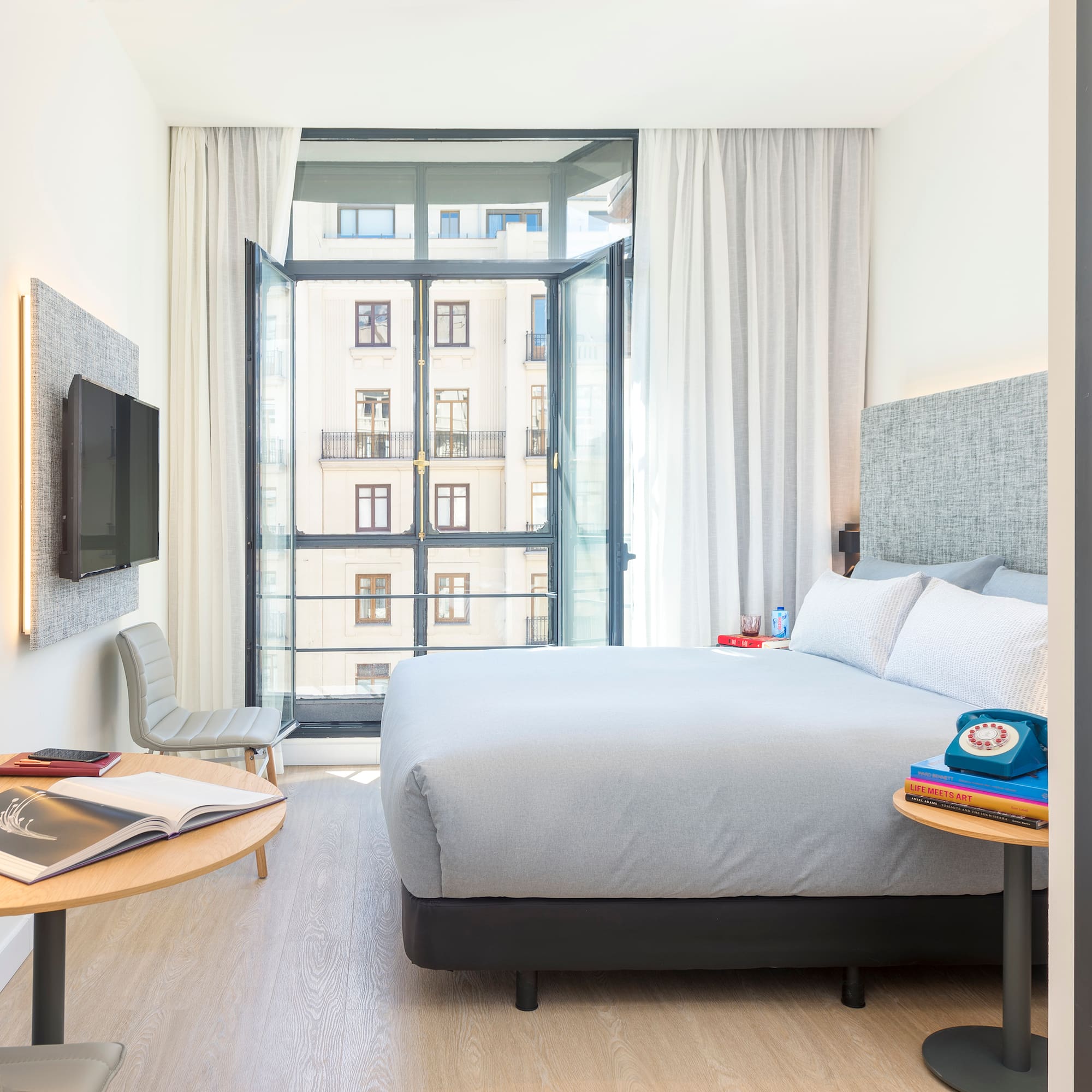 a bedroom with a bed and a tv