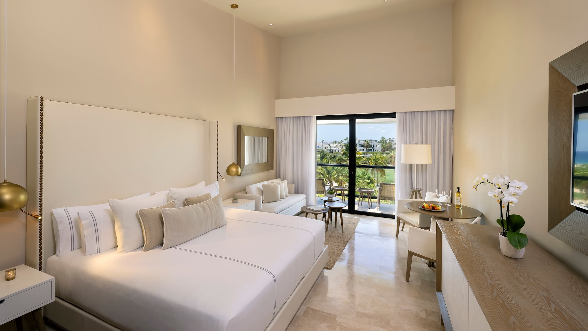 a room with a bed and a table and chairs