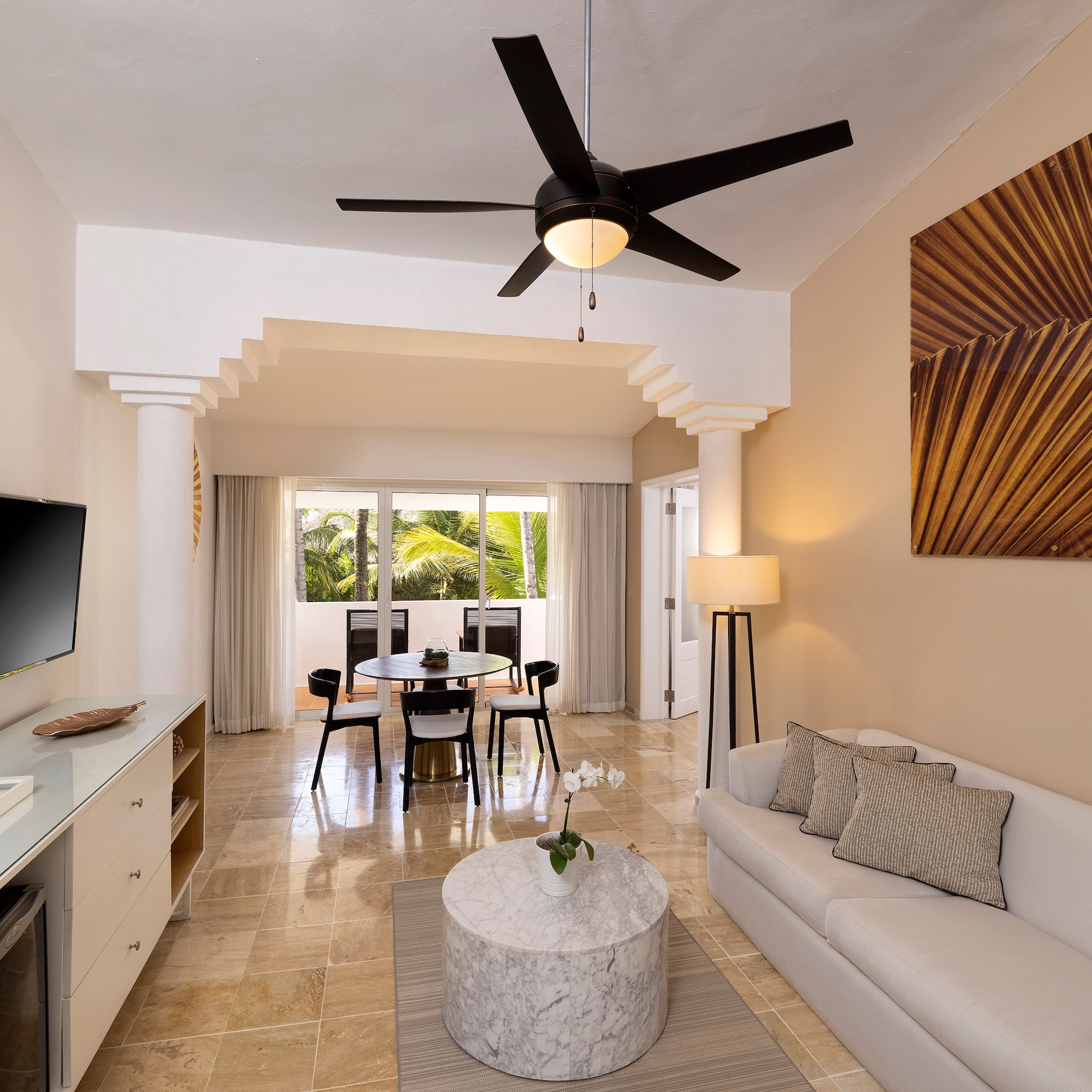 a living room with a tv and a table