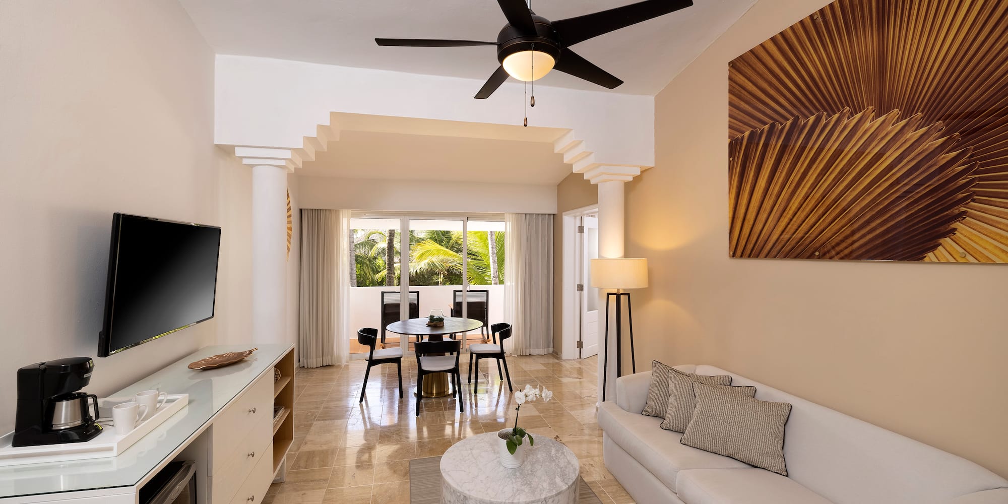 a living room with a tv and a table