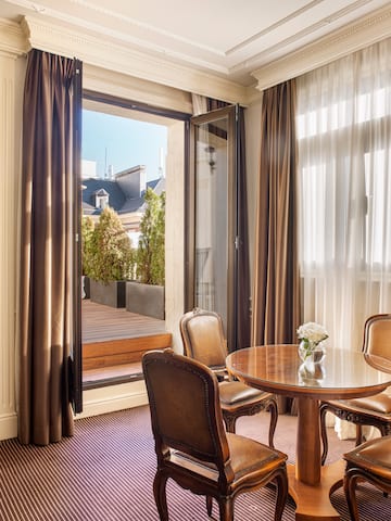 a room with a table and chairs