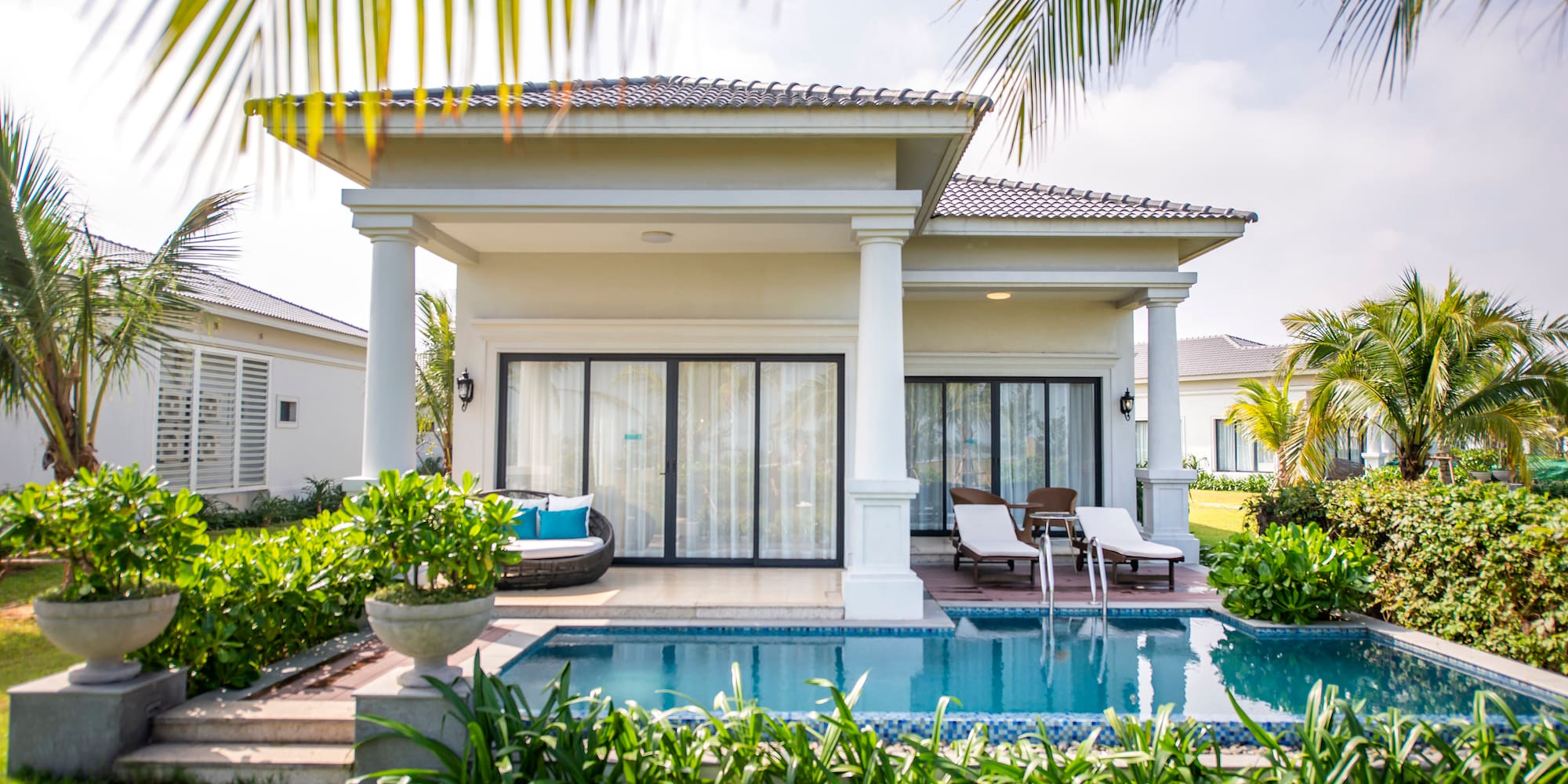 a pool in front of a house