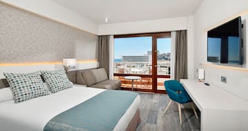 a room with a bed and a desk