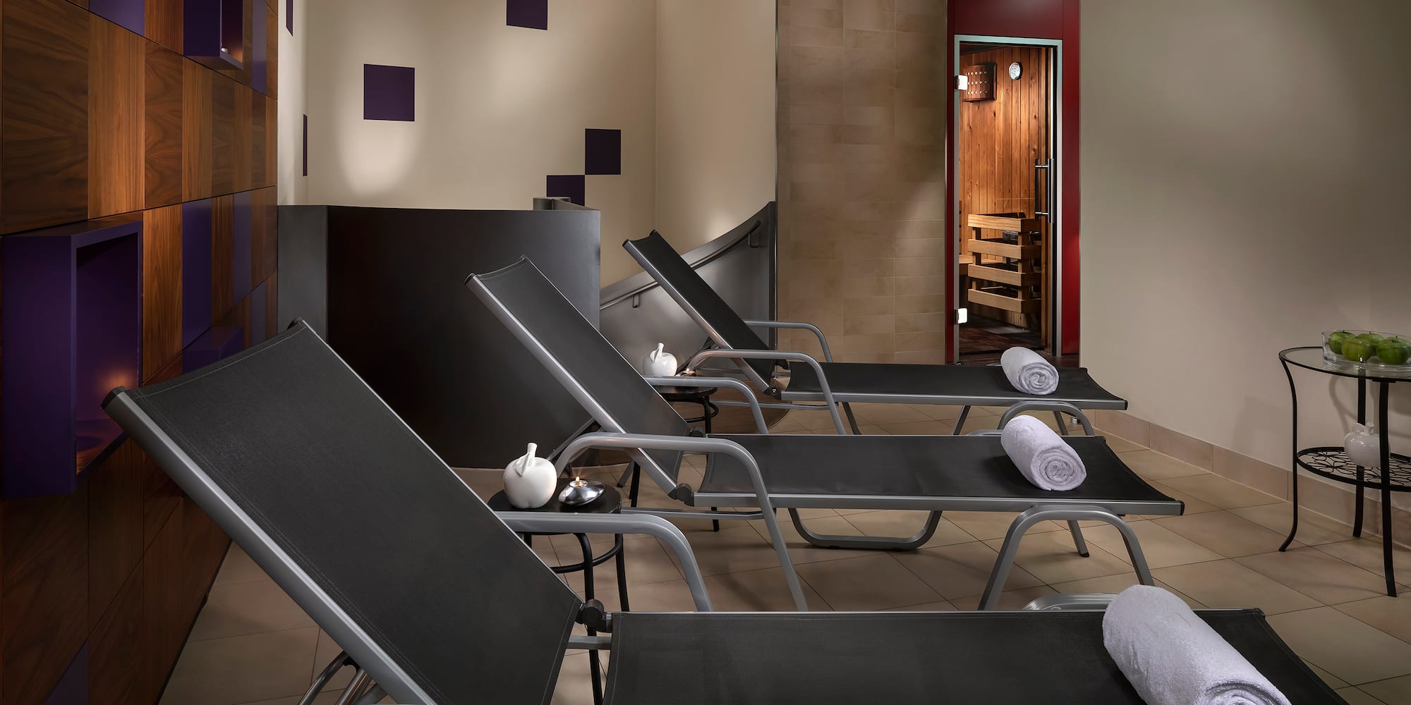 a room with chairs and towels