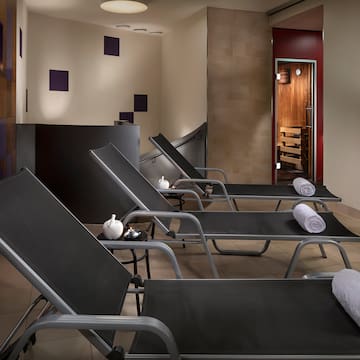 a group of lounge chairs in a room