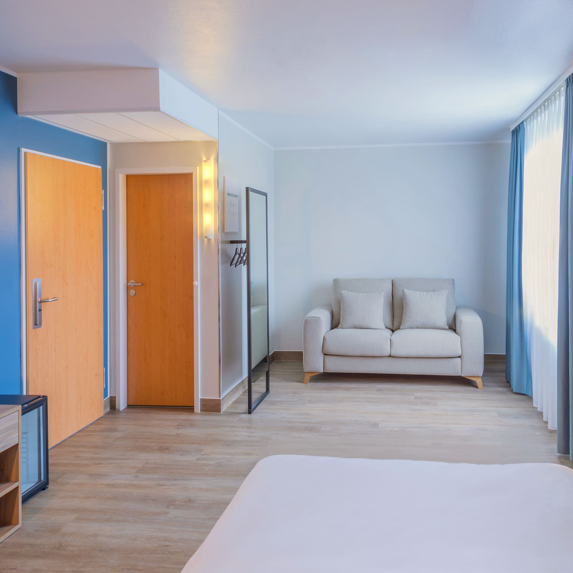 a room with a bed and a couch