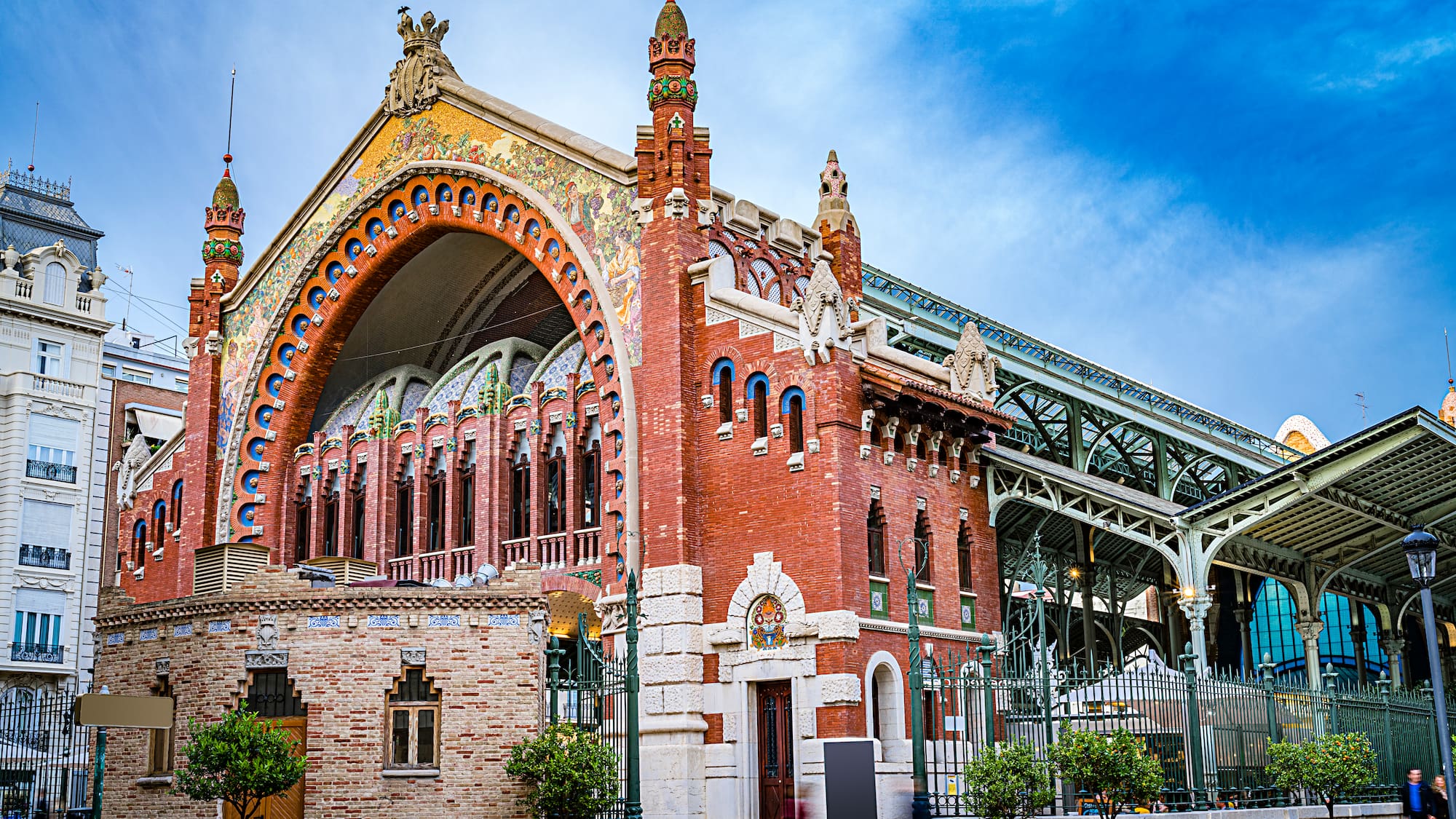 a building with a bridge and a blue sky