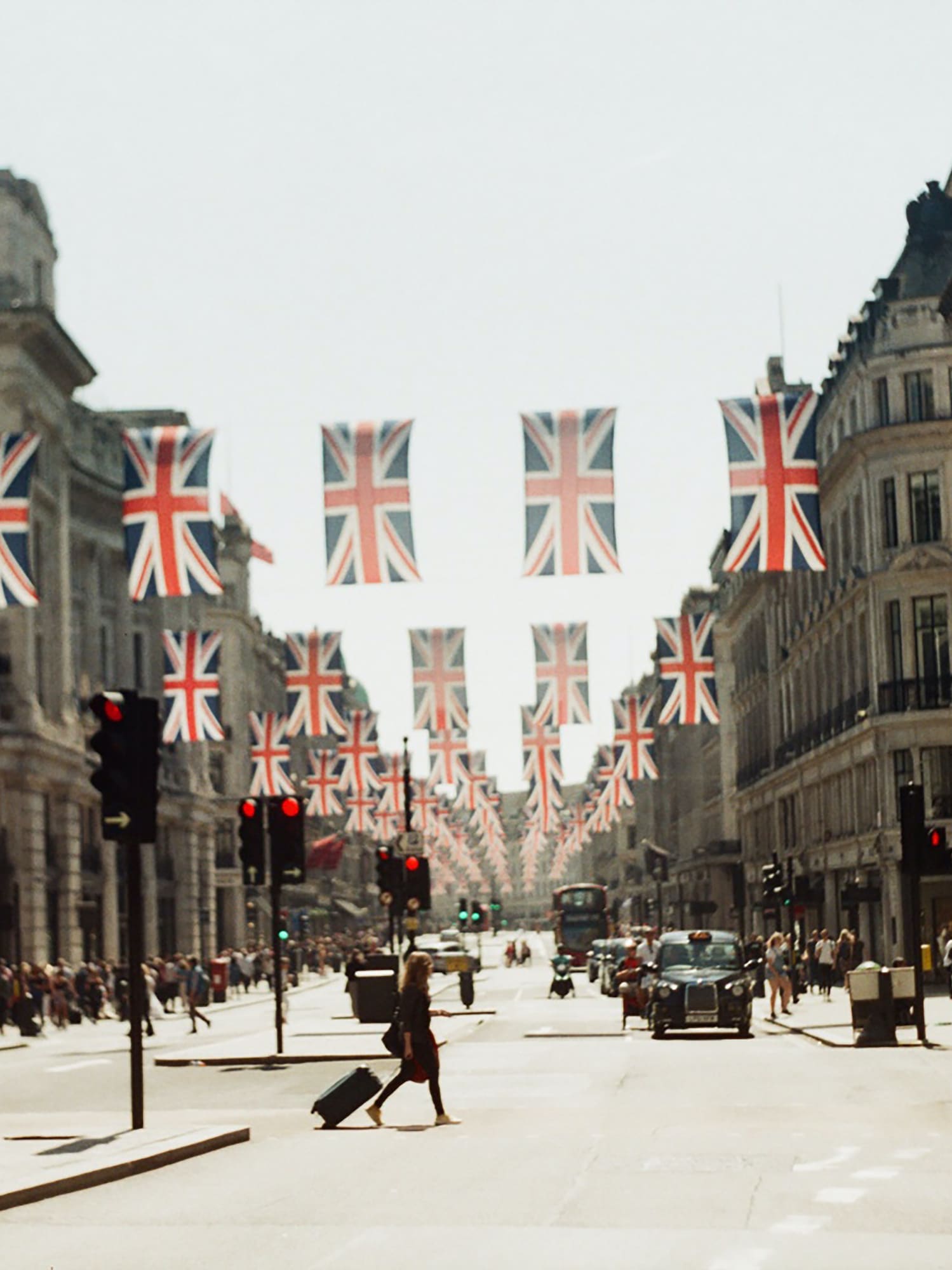 a street with flags from the ceiling
