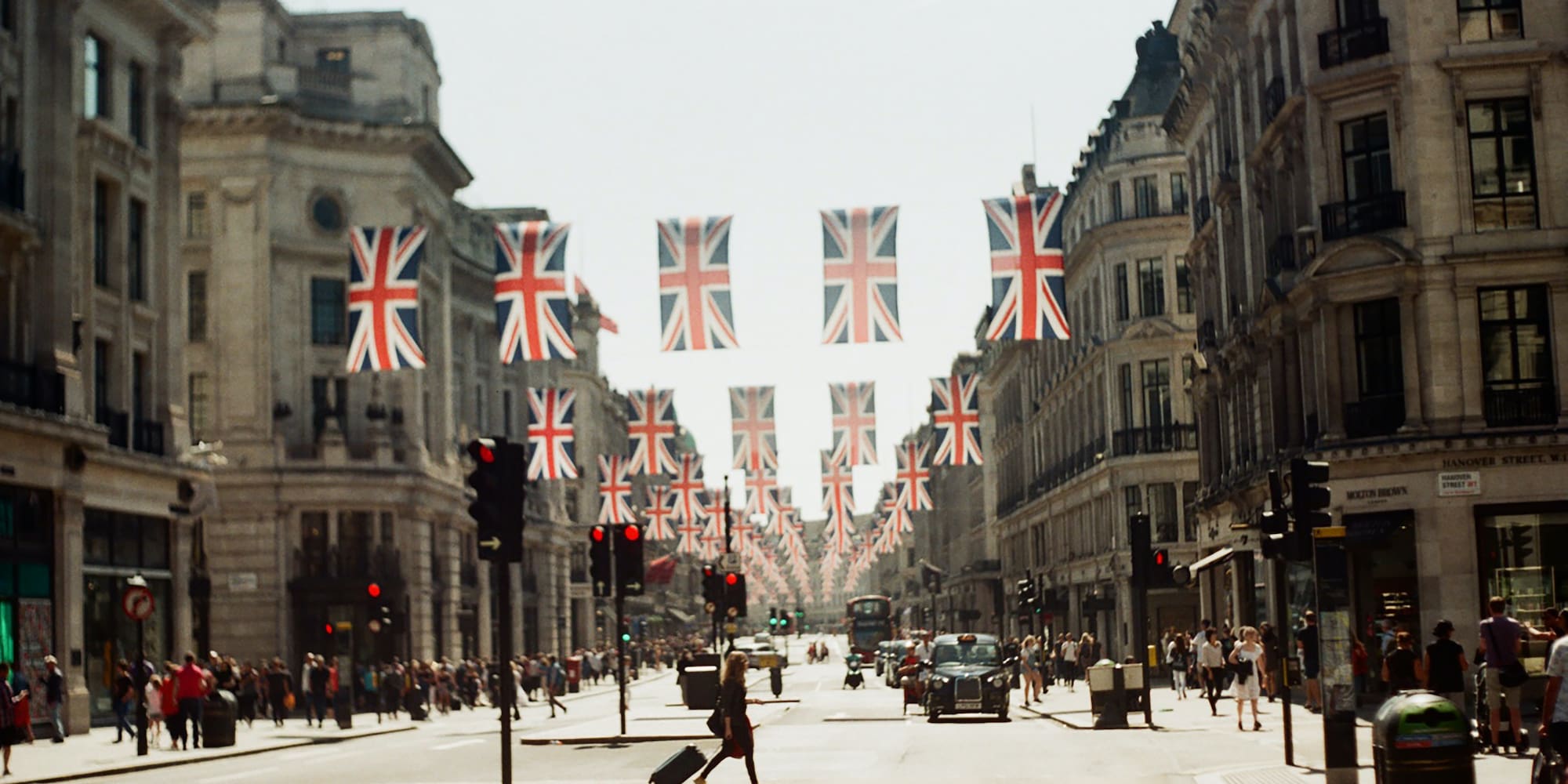 a street with flags from the ceiling