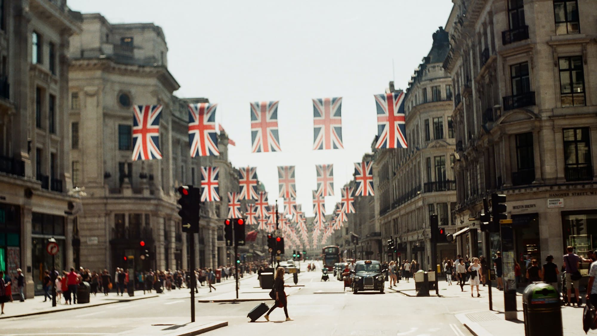 a street with flags from the ceiling