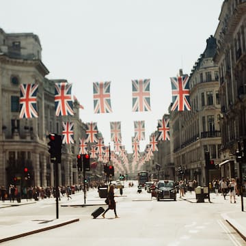 a street with flags from the ceiling