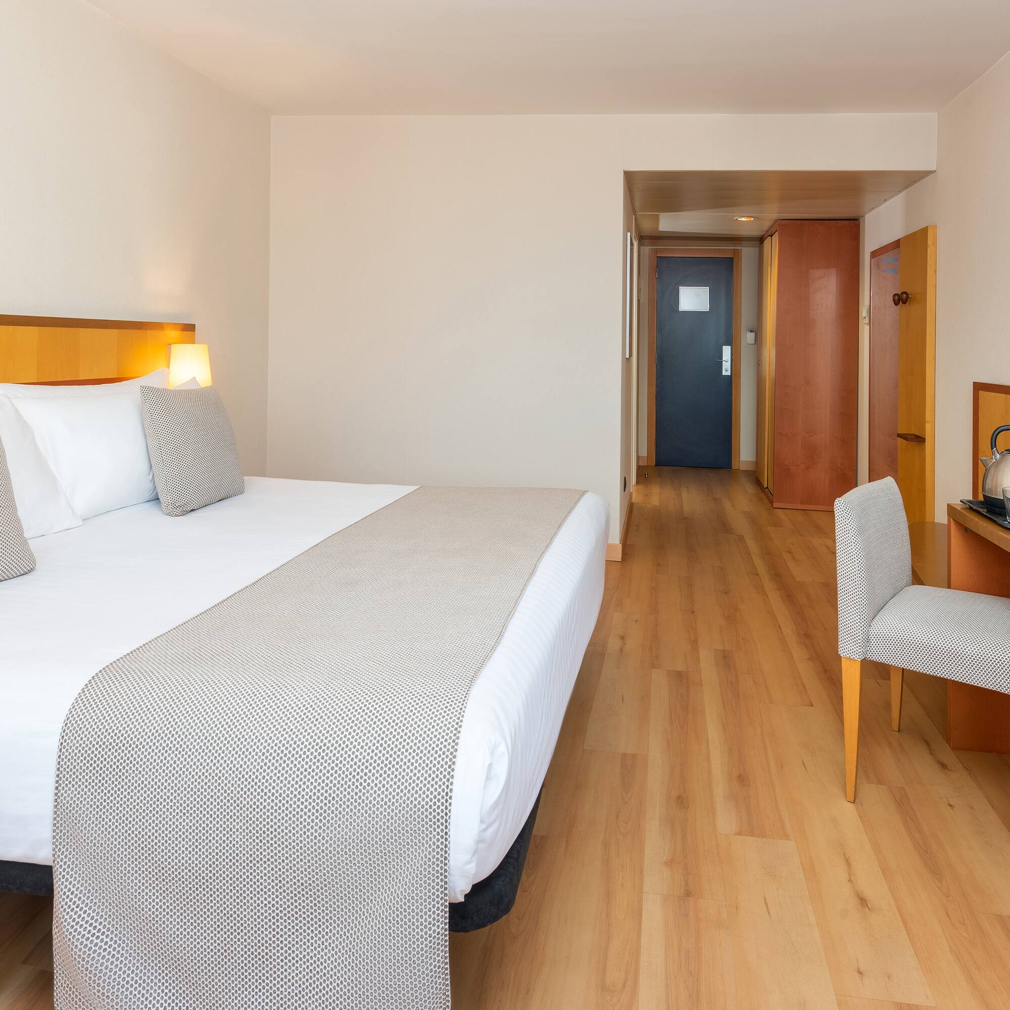 a room with a bed and a chair