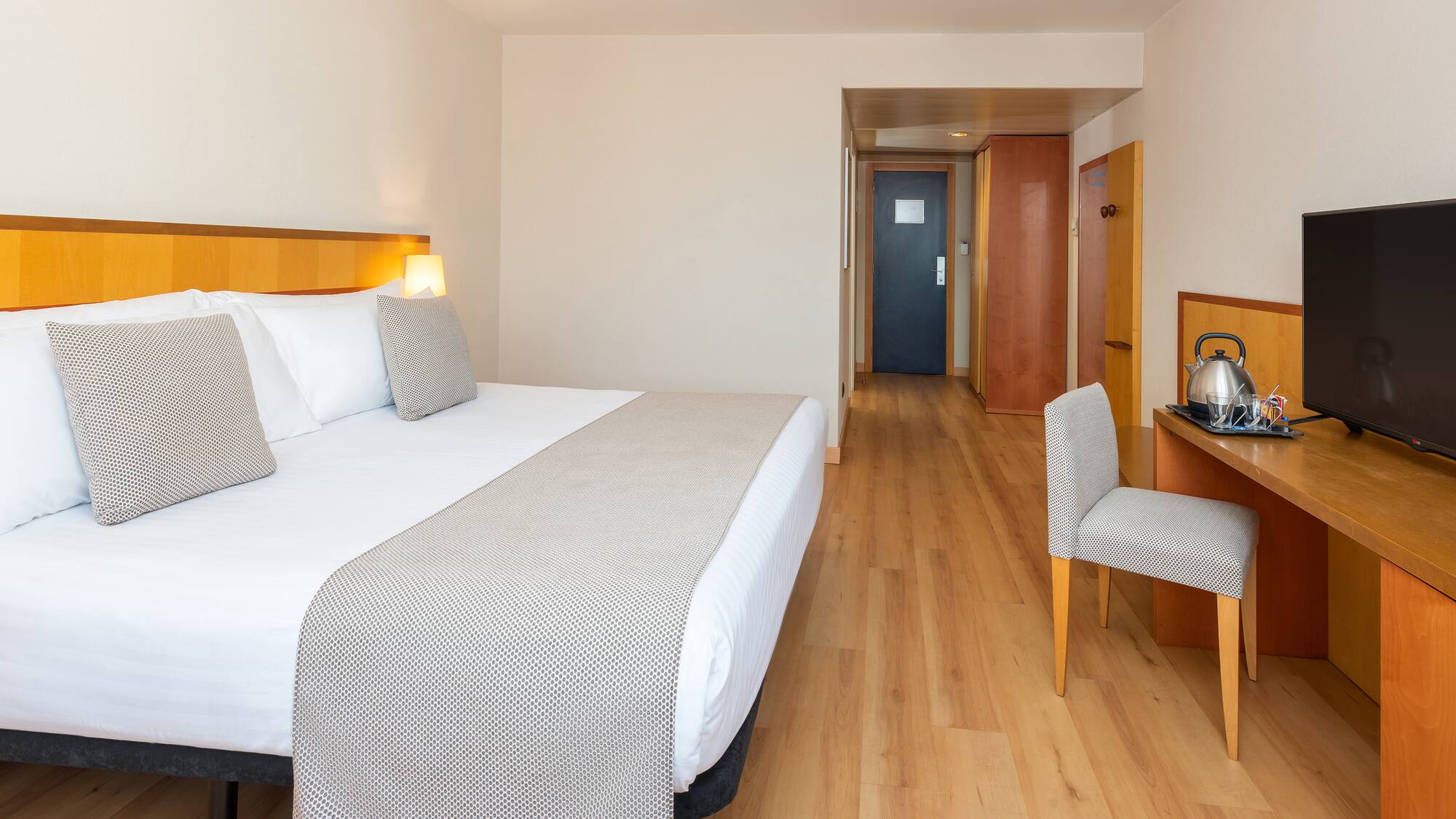 a room with a bed and a chair