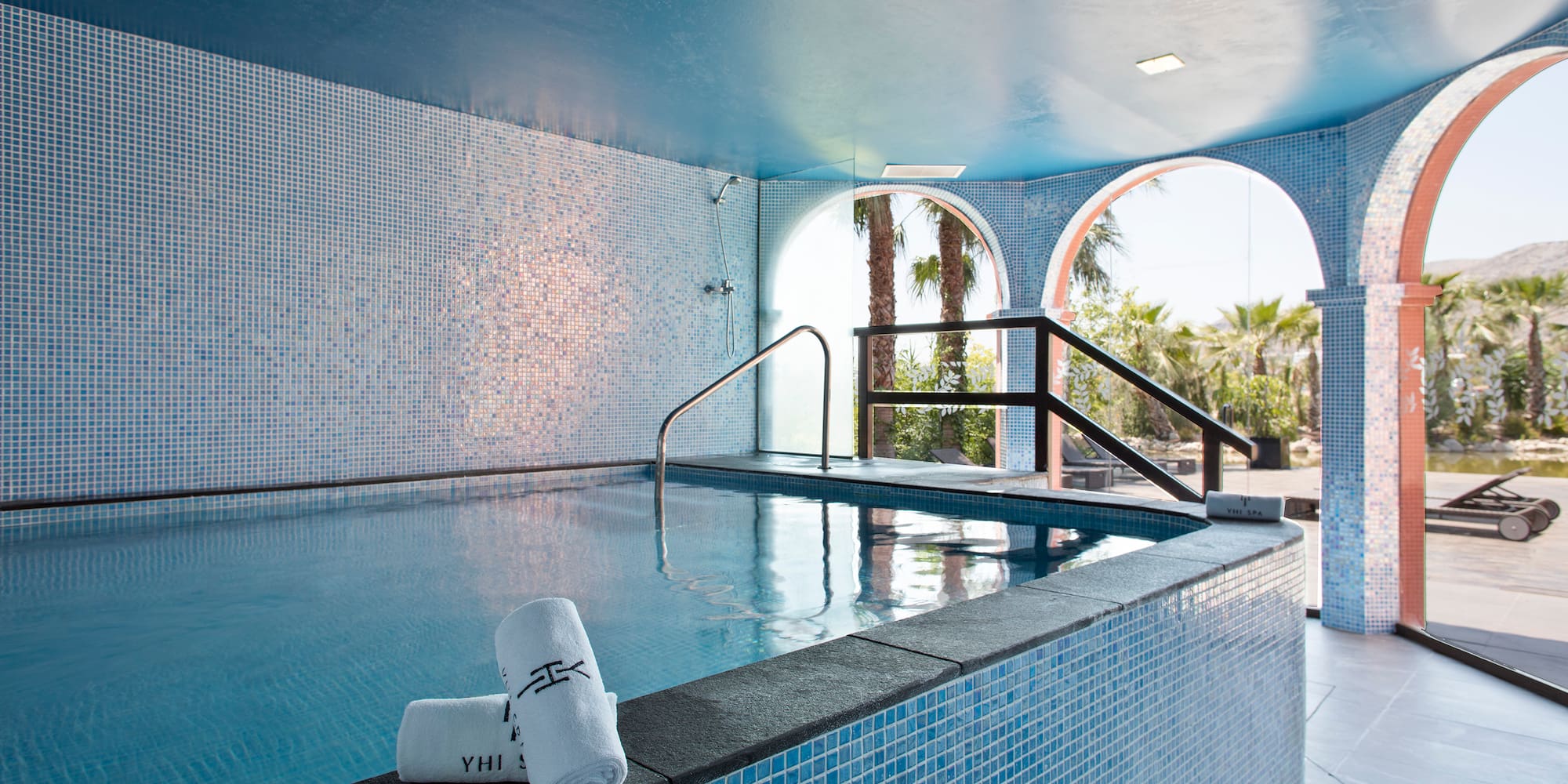 a pool with towels on the side