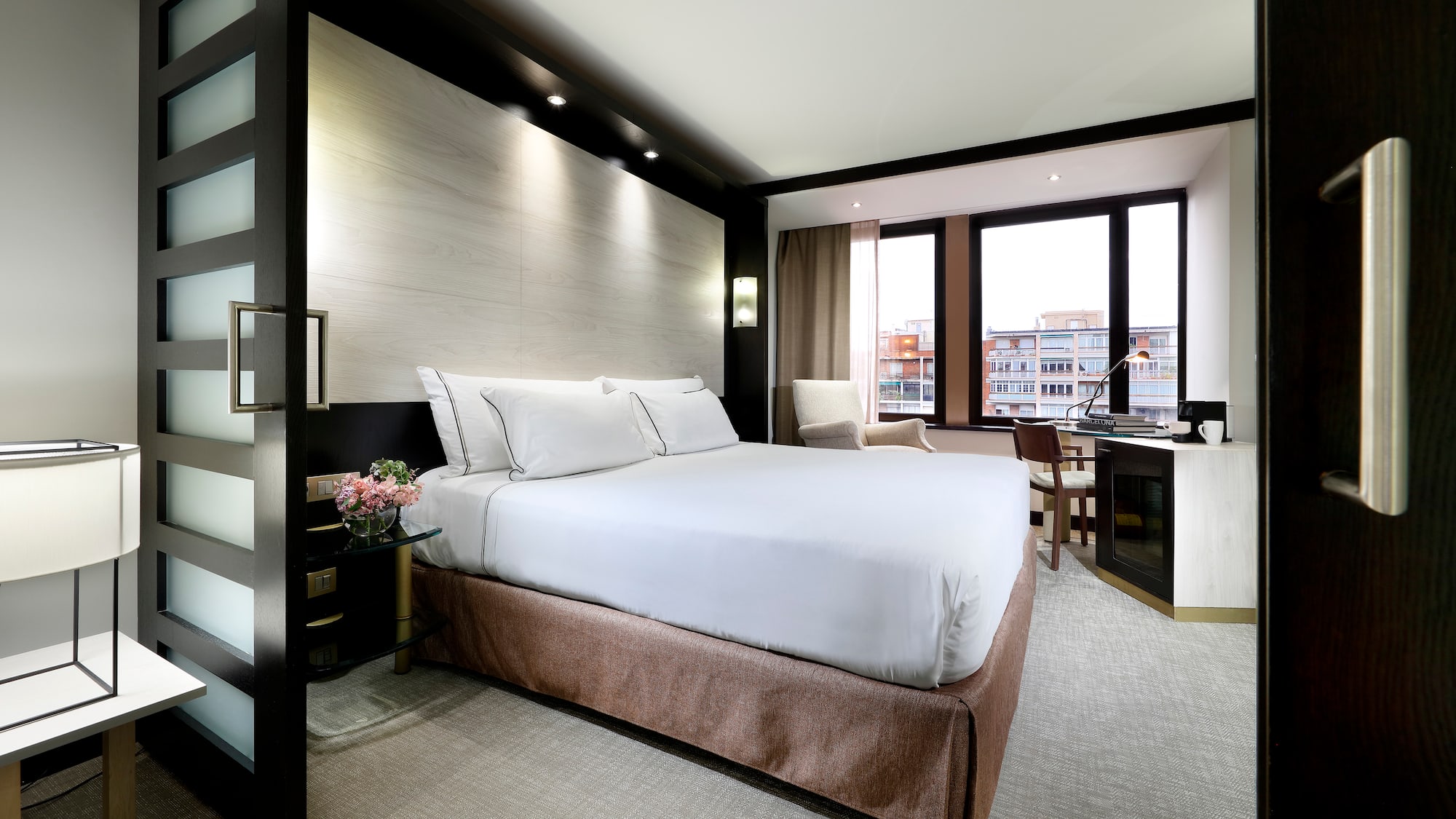 a room with a bed and a desk