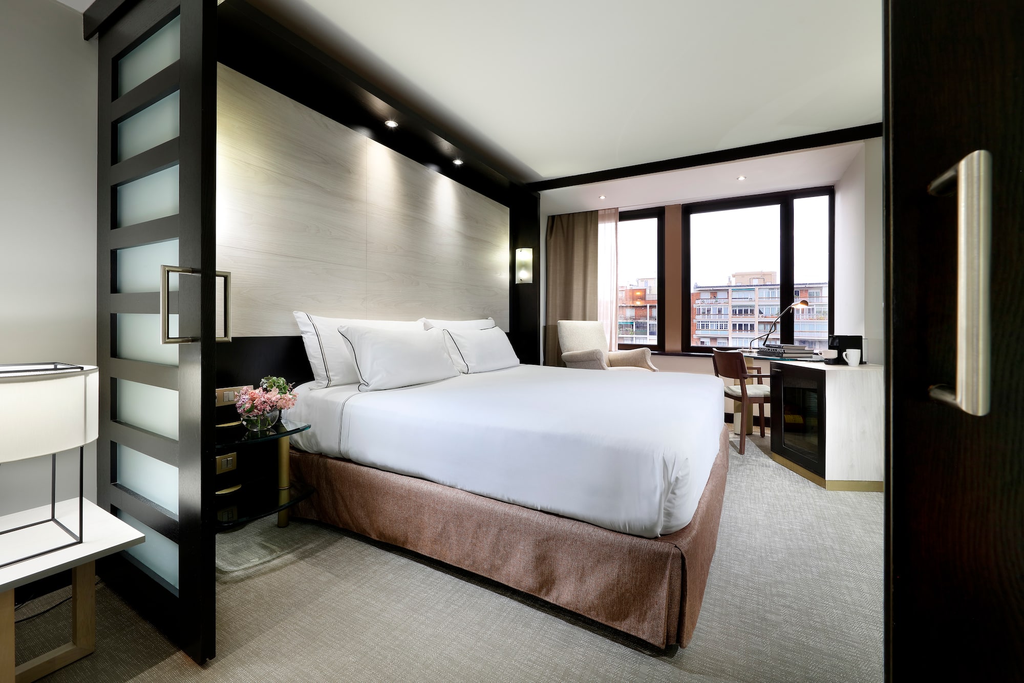 a room with a bed and a desk