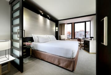 a room with a bed and a desk