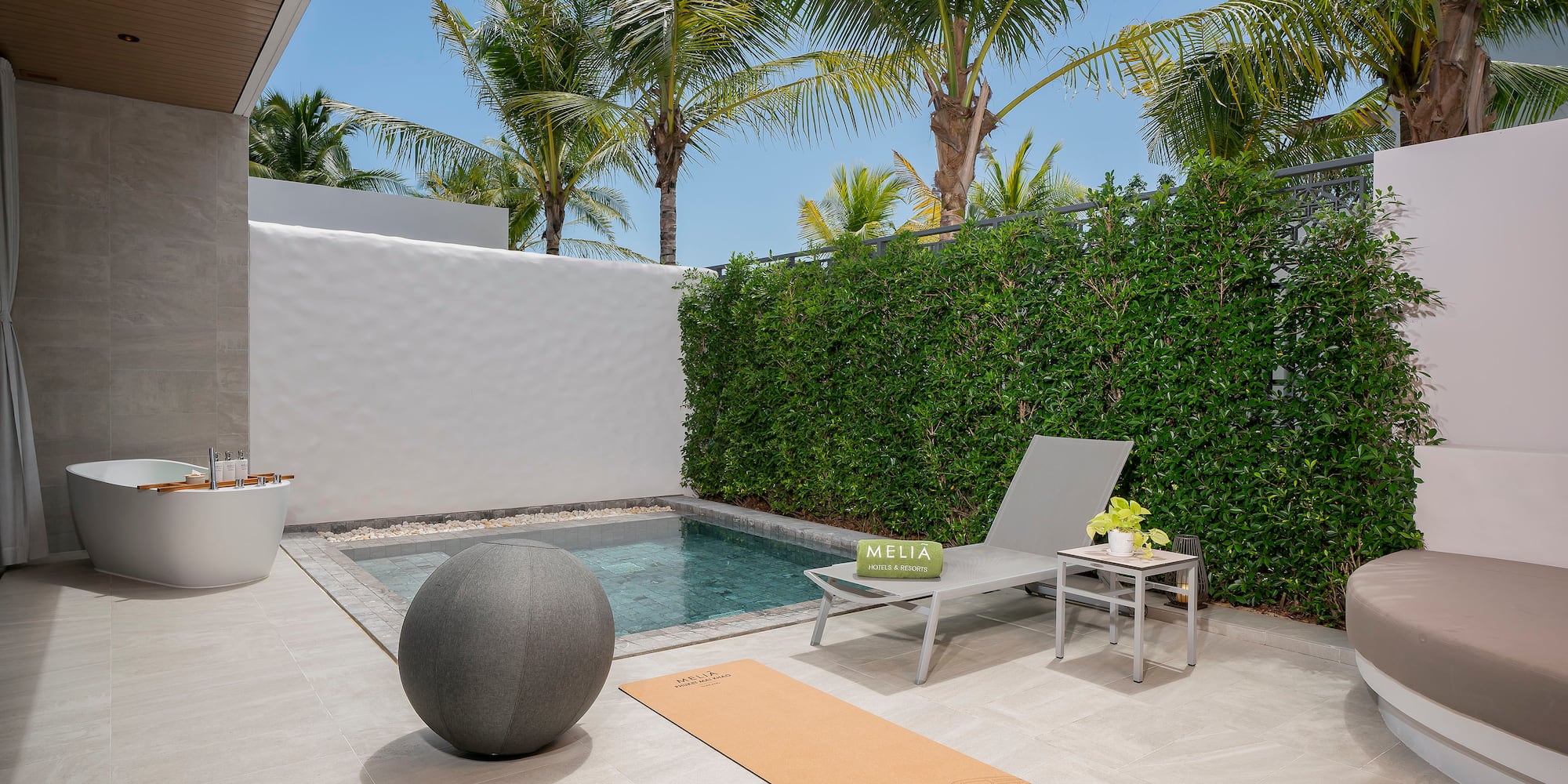 a pool and chair on a patio