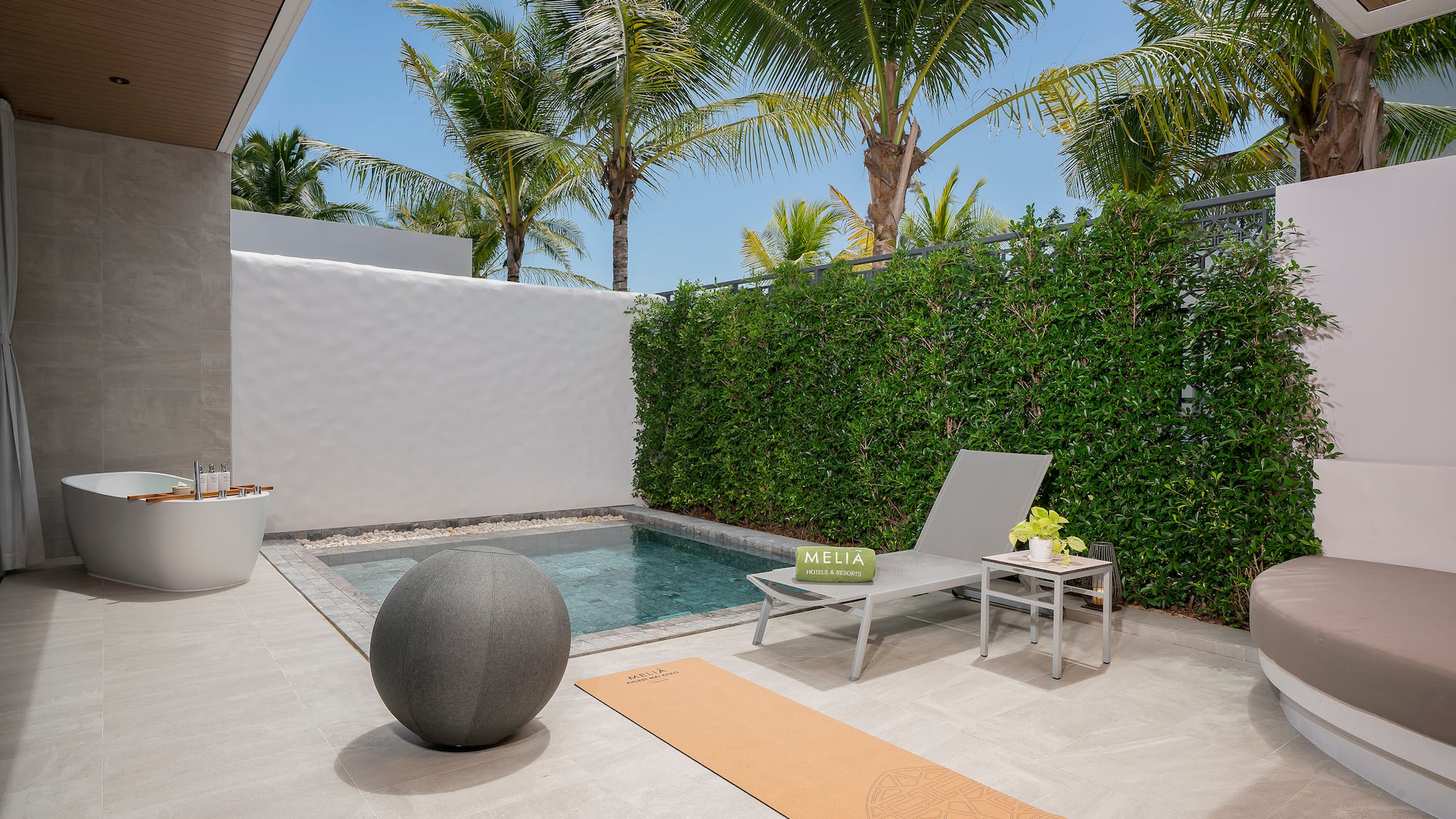 a pool and chair on a patio