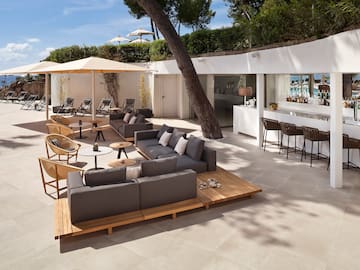 a patio with furniture and tables