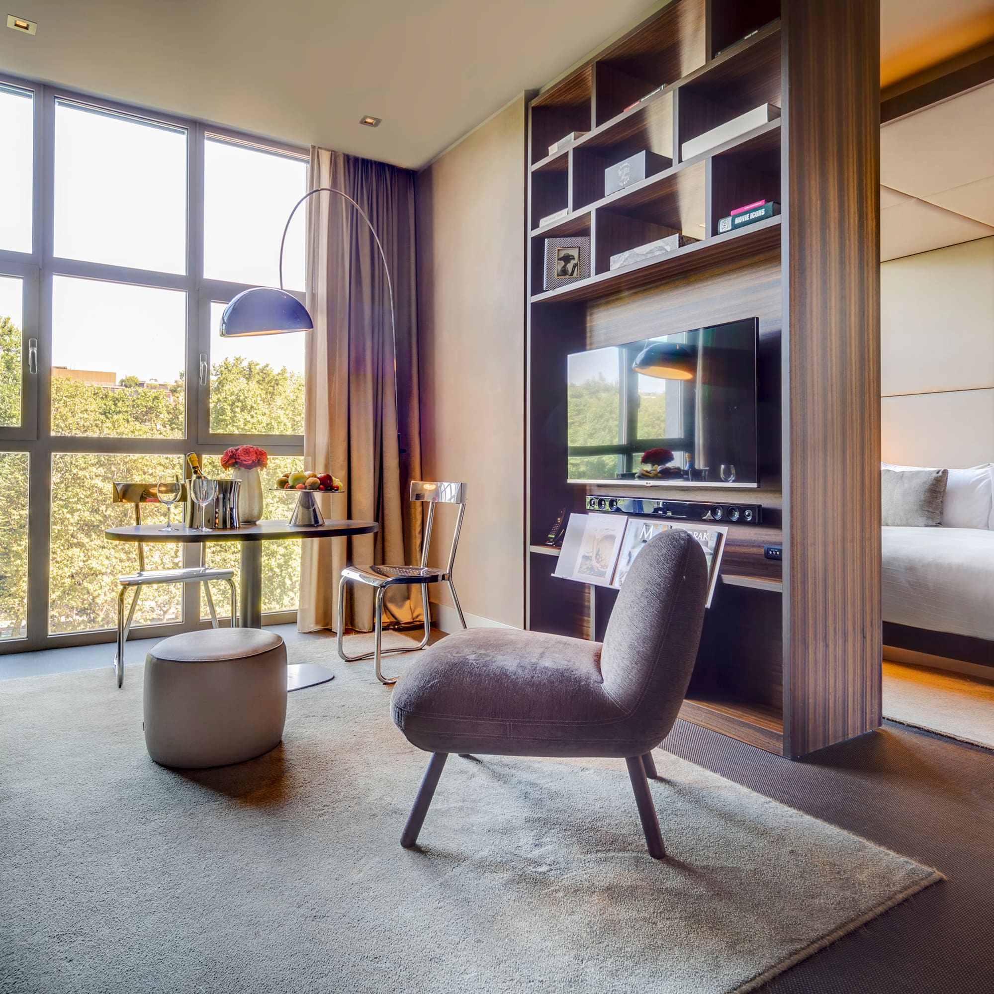 a room with a tv and a bed