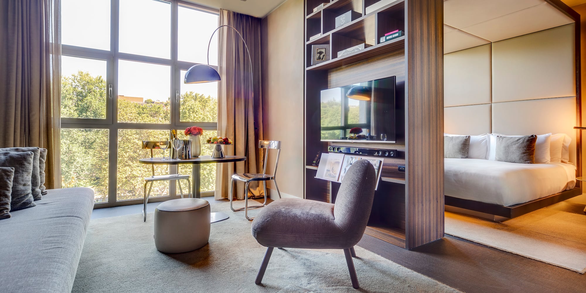 a room with a tv and a bed