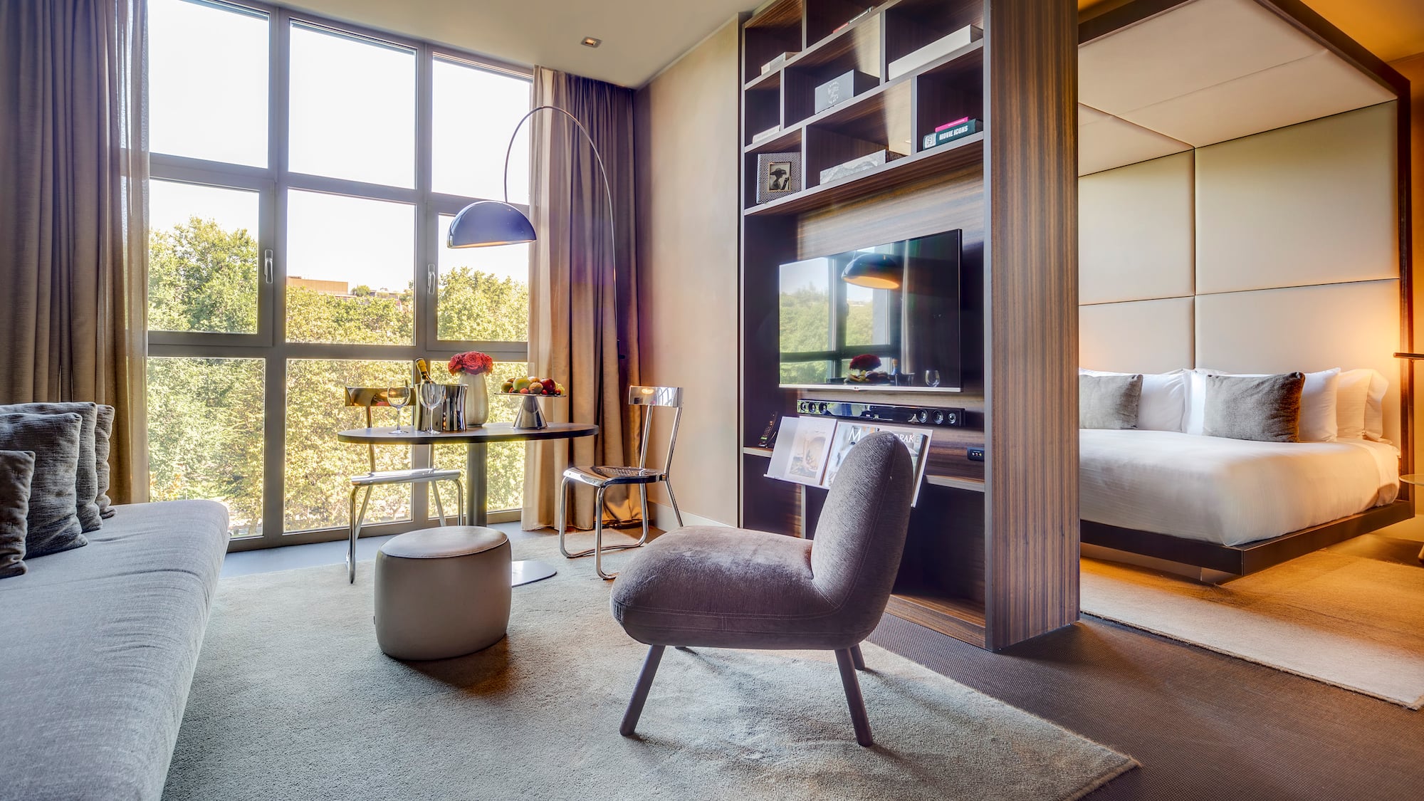 a room with a tv and a bed