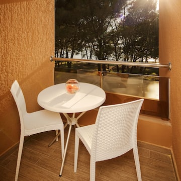 a table and chairs outside a window