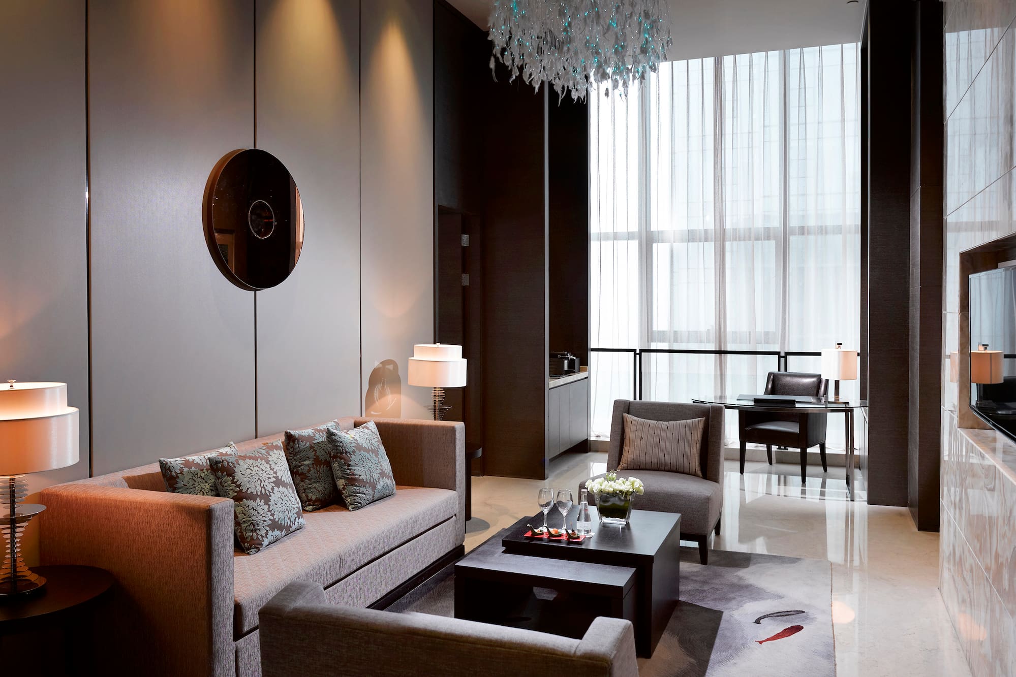 a living room with couches and chairs