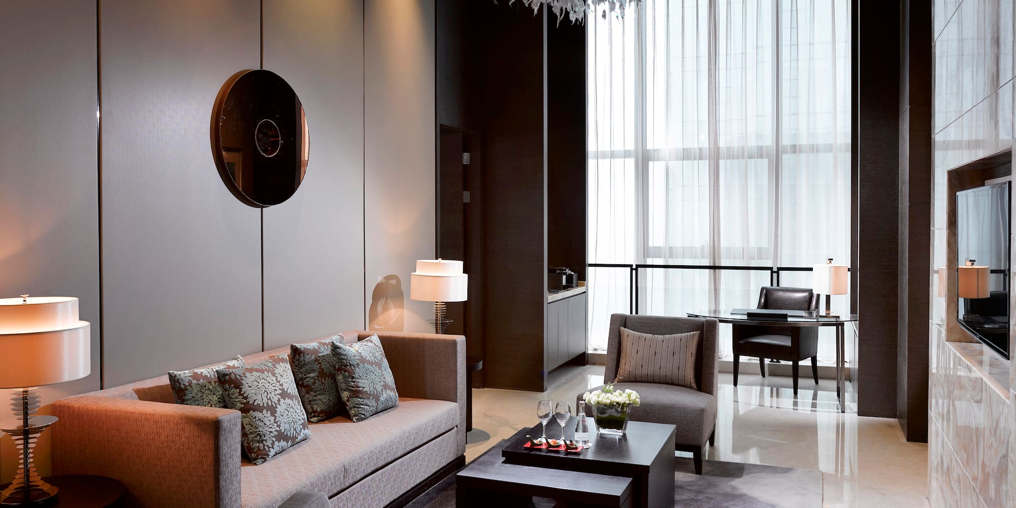 a living room with couches and chairs