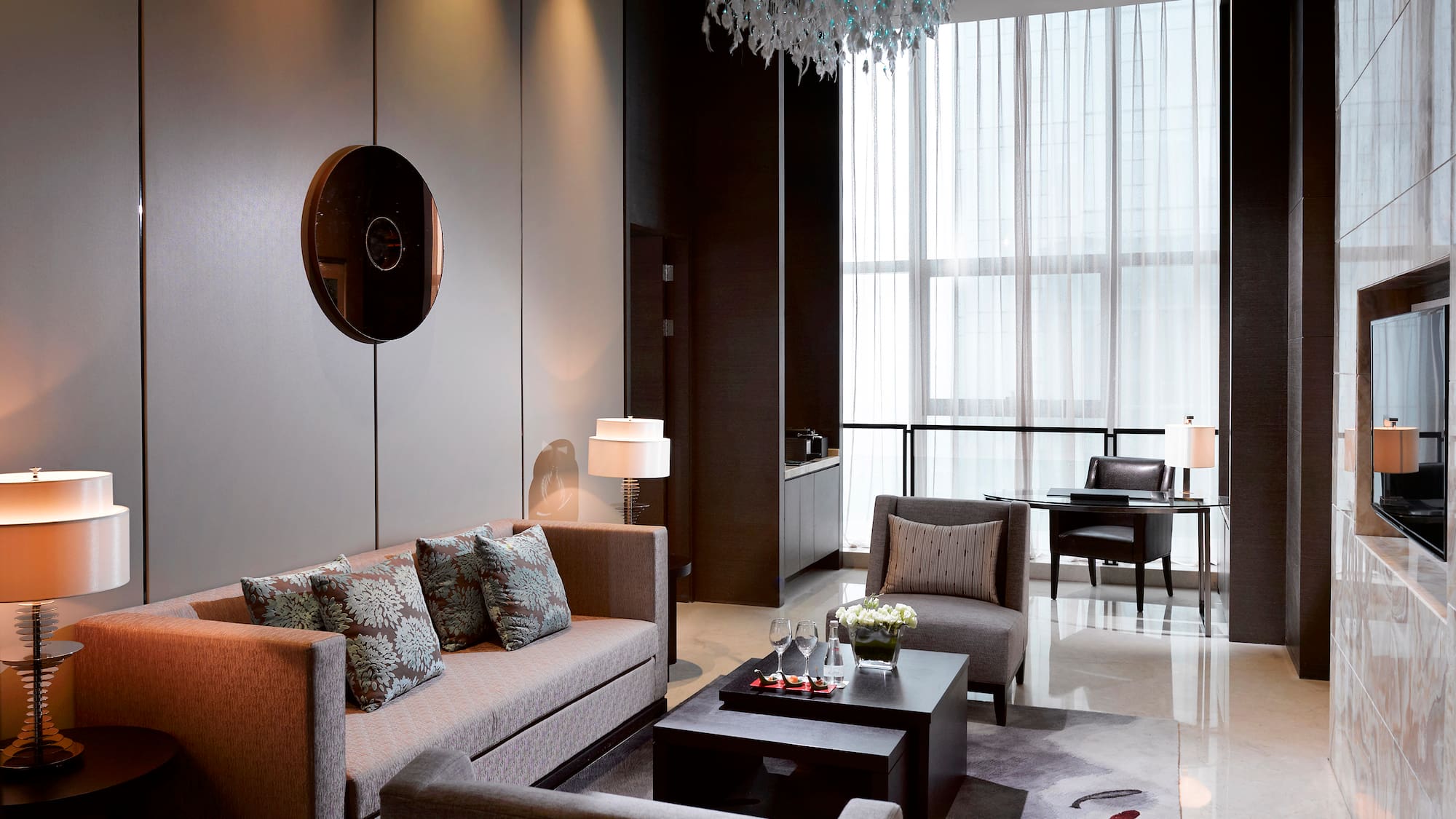 a living room with couches and chairs