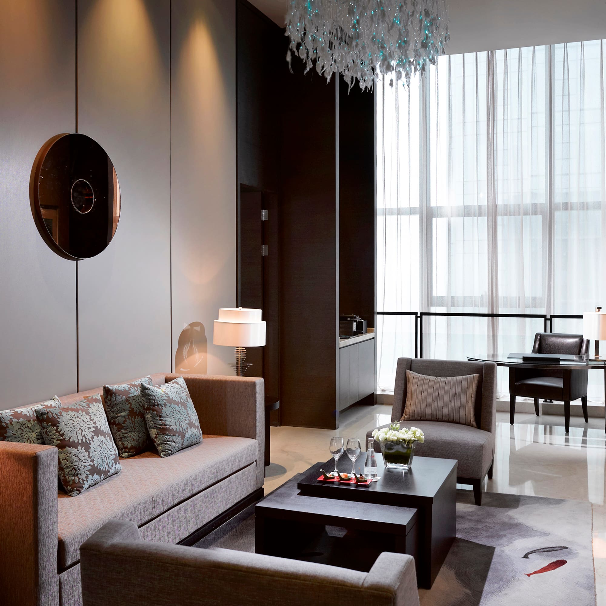 a living room with couches and chairs