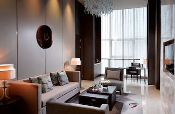 a living room with couches and chairs