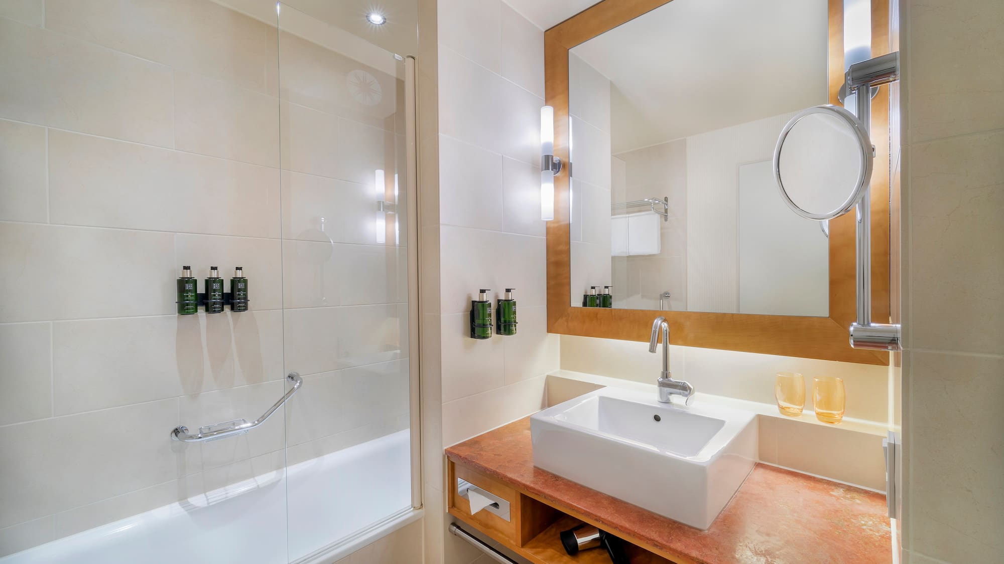 a bathroom with a mirror and sink