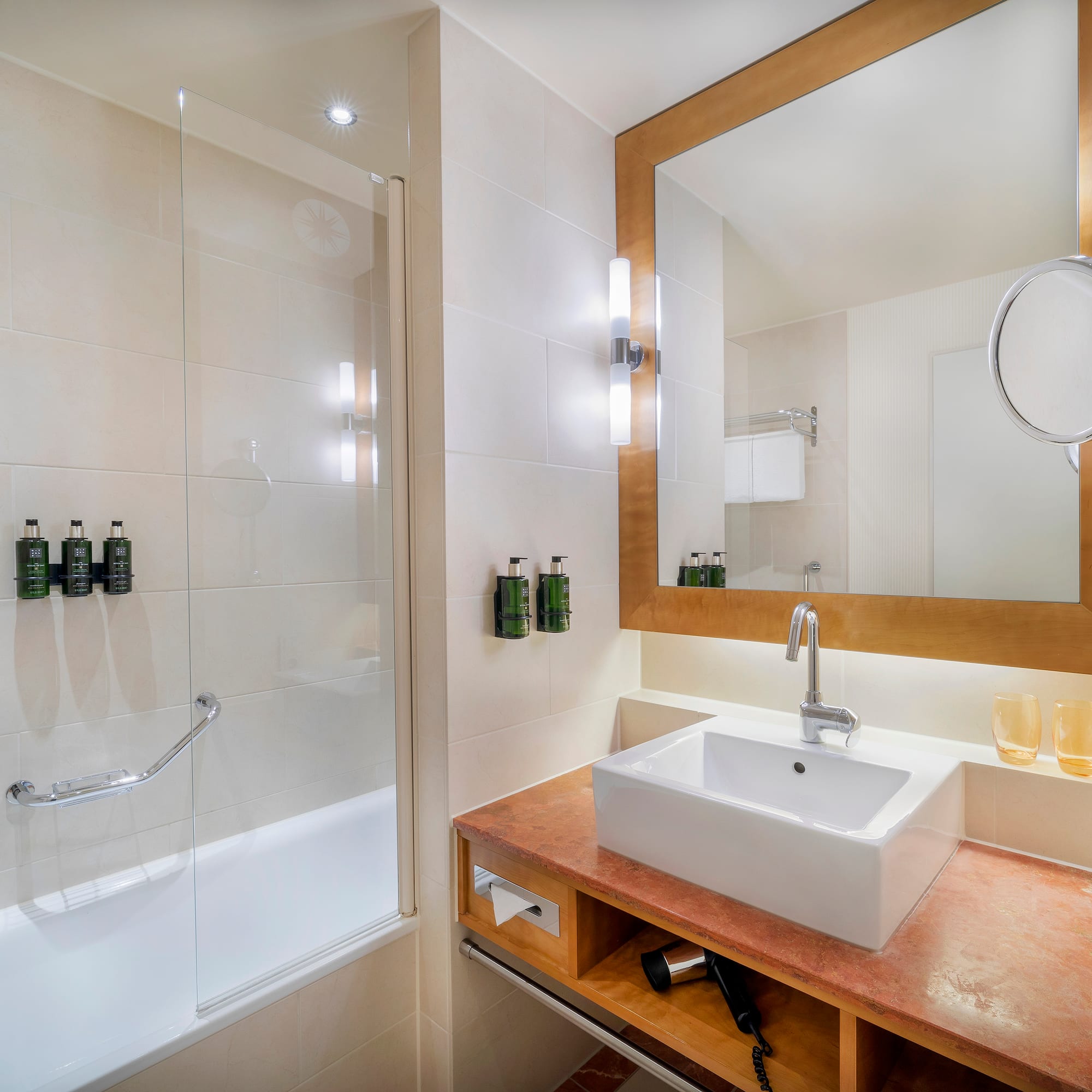 a bathroom with a mirror and sink