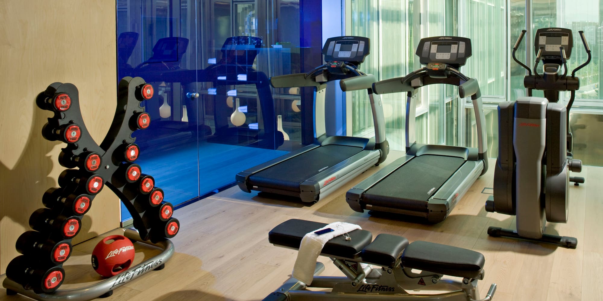a room with treadmills and exercise equipment