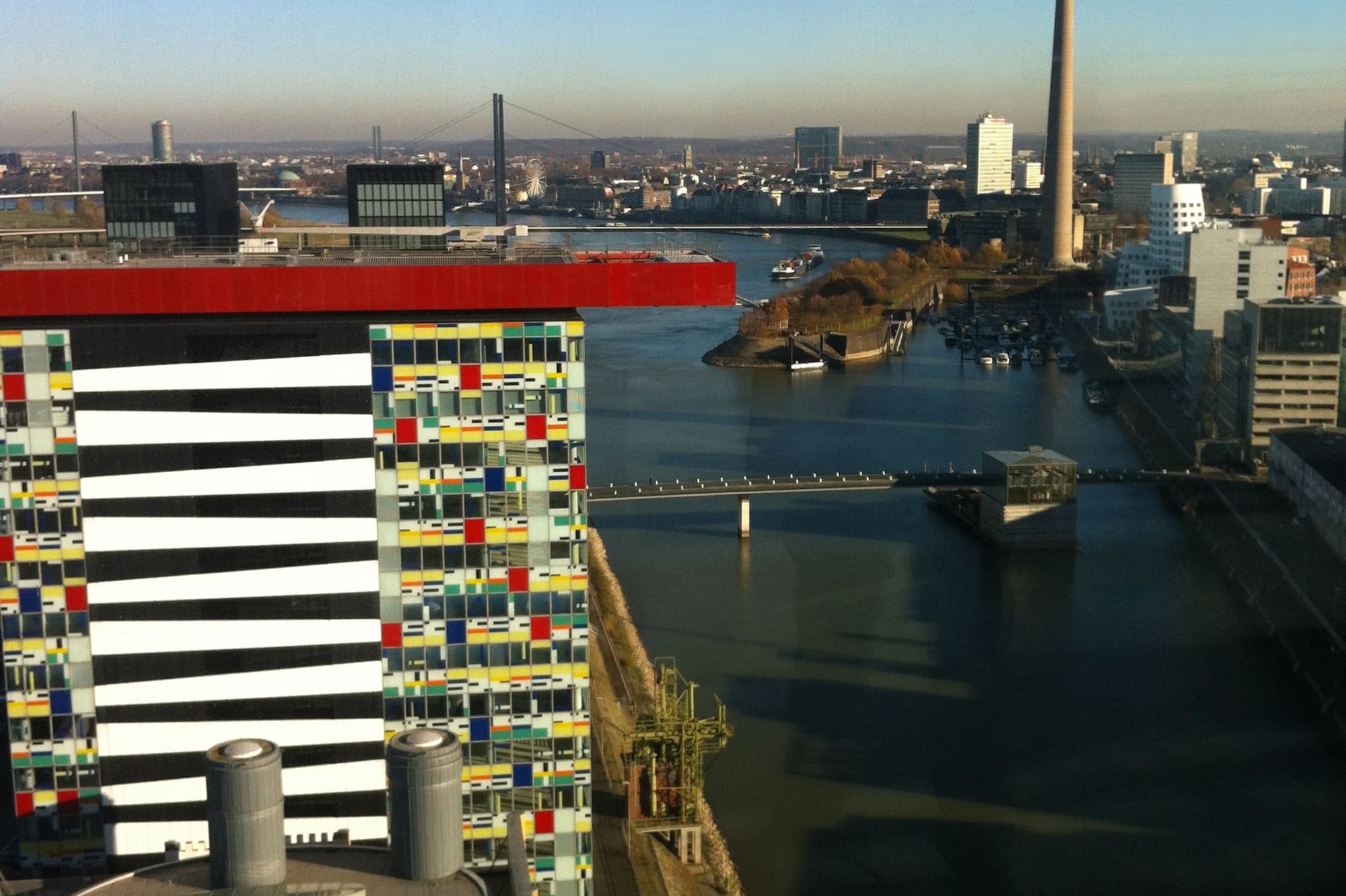 a city with a river and a tower