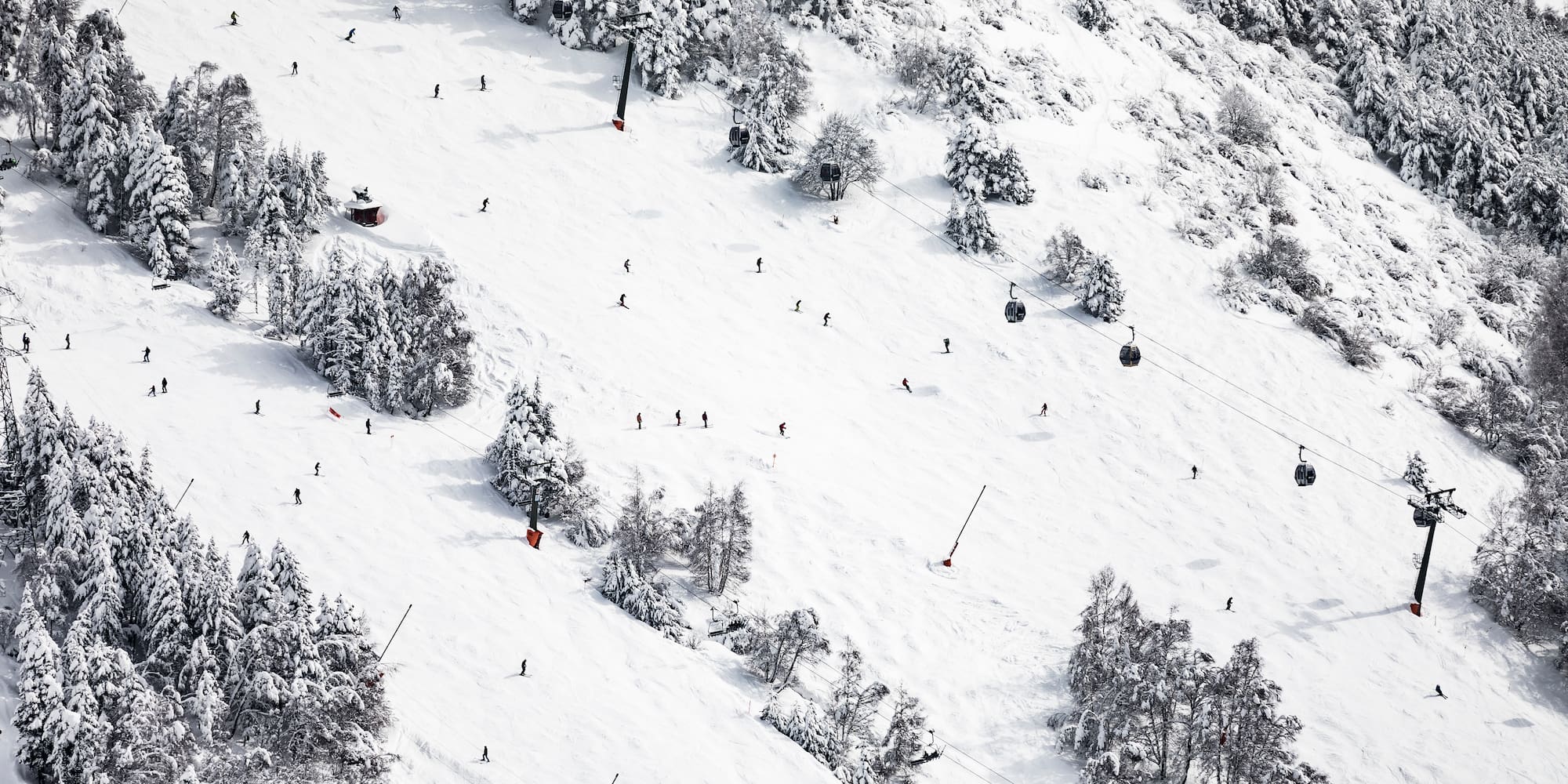 a group of people skiing on a snowy mountain